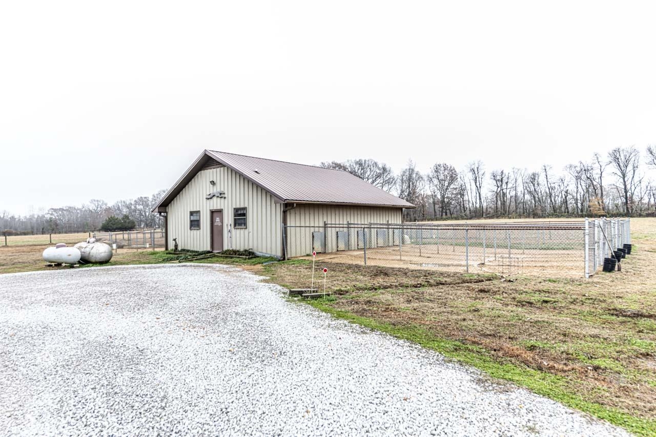 3899 Kerr Road Millington, TN 38053 - Photo 7 of 25 a view of a house with a big yard and large tree