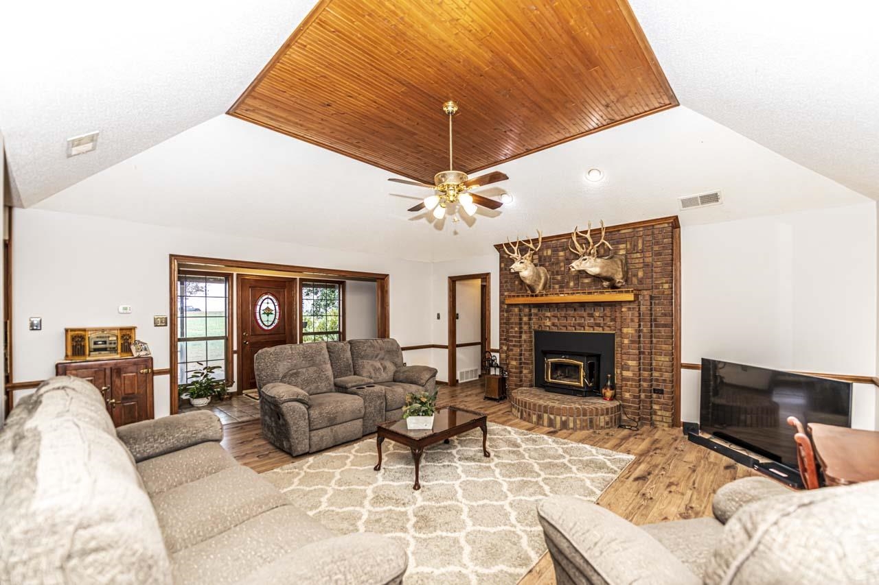 3899 Kerr Road Millington, TN 38053 - Photo 10 of 25 a living room with furniture a fireplace and a flat screen tv
