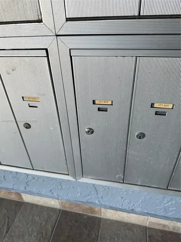 a backyard of a house with wooden fence and a bench