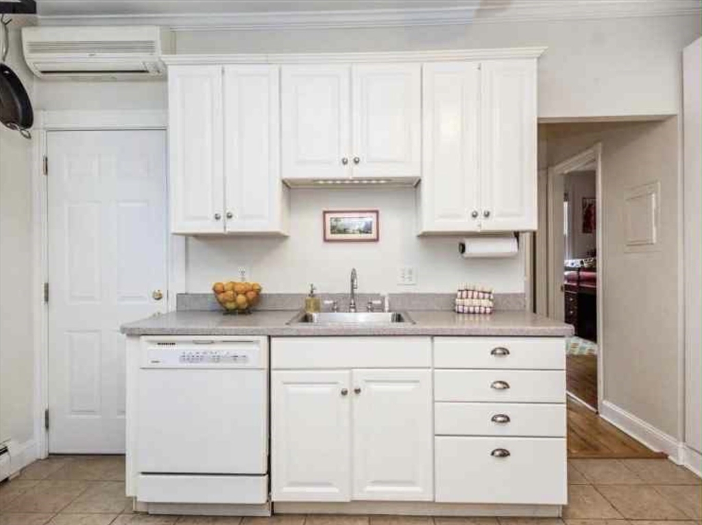 34 Austin Street, Unit 2 Boston, MA 02129 - Photo 11 of 19 a kitchen with granite countertop white cabinets and white appliances