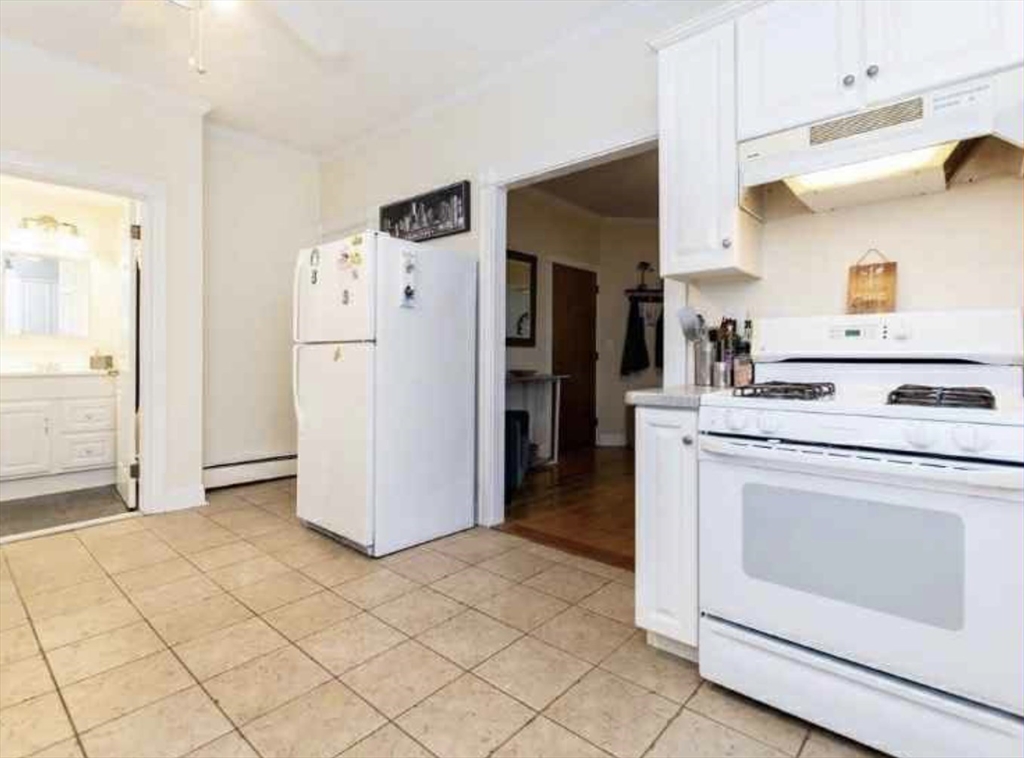 34 Austin Street, Unit 2 Boston, MA 02129 - Photo 12 of 19 a kitchen with a refrigerator sink and cabinets
