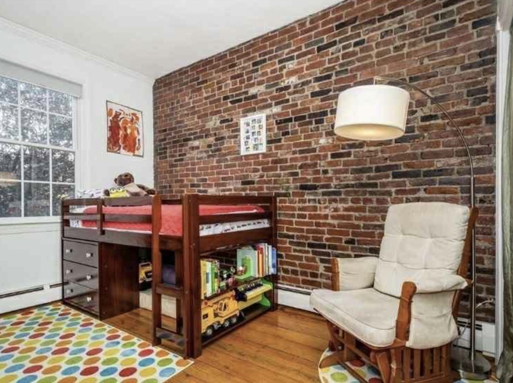 34 Austin Street, Unit 2 Boston, MA 02129 - Photo 15 of 19 a bedroom with a bed and a chair