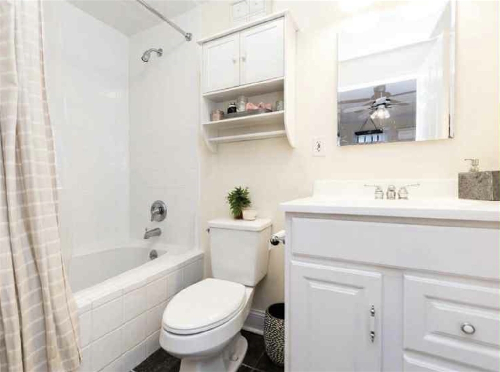 34 Austin Street, Unit 2 Boston, MA 02129 - Photo 18 of 19 a bathroom with a sink toilet and shower