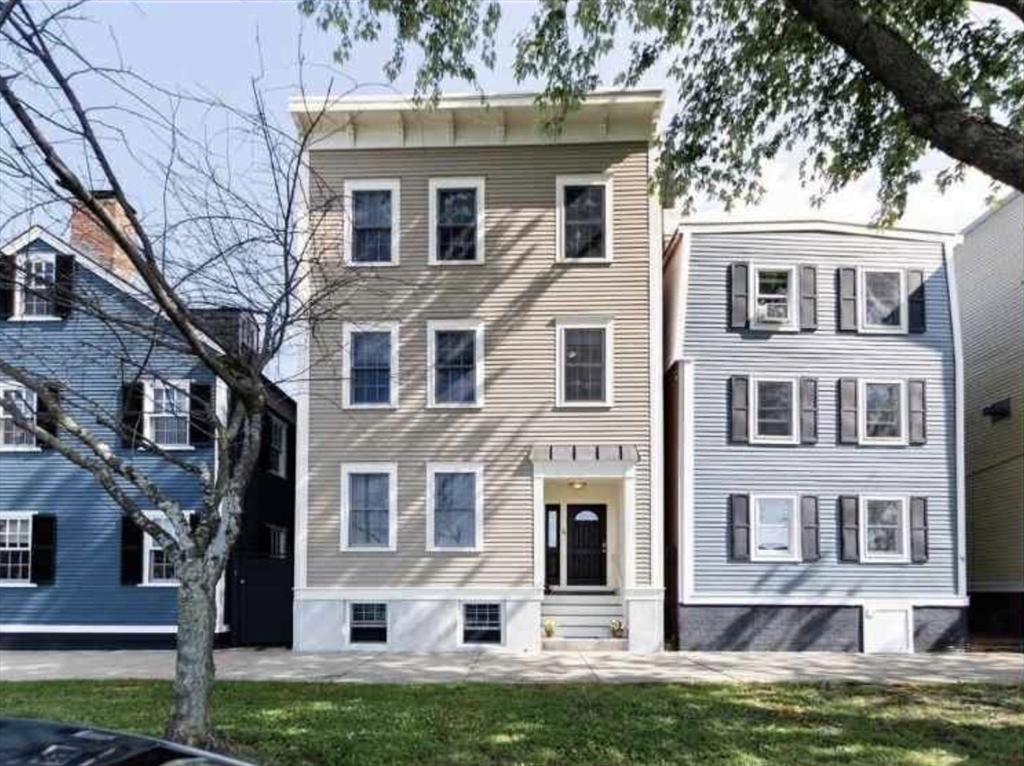 34 Austin Street, Unit 2 Boston, MA 02129 - Photo 19 of 19 a front view of a house with a yard