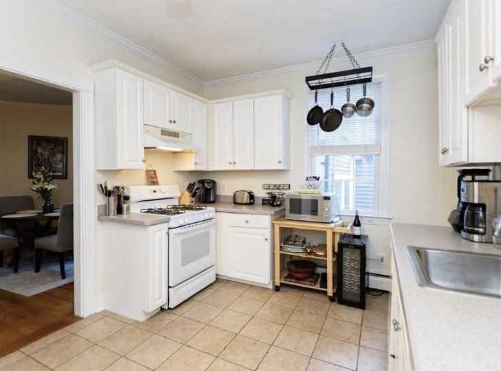 34 Austin Street, Unit 2 Boston, MA 02129 - Photo 2 of 19 a kitchen with a stove and a sink