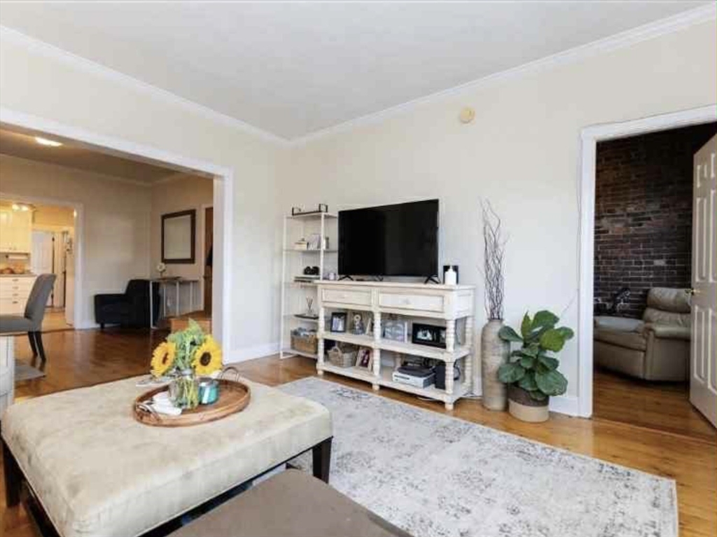 34 Austin Street, Unit 2 Boston, MA 02129 - Photo 3 of 19 a living room with furniture and a flat screen tv