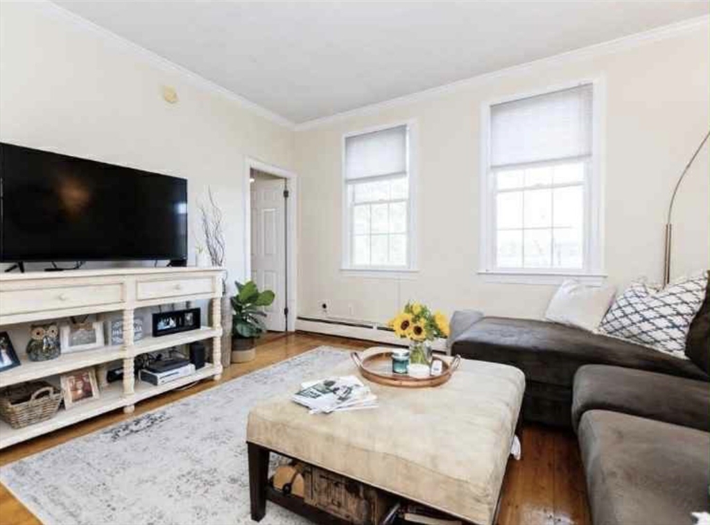 34 Austin Street, Unit 2 Boston, MA 02129 - Photo 5 of 19 a living room with furniture and a flat screen tv