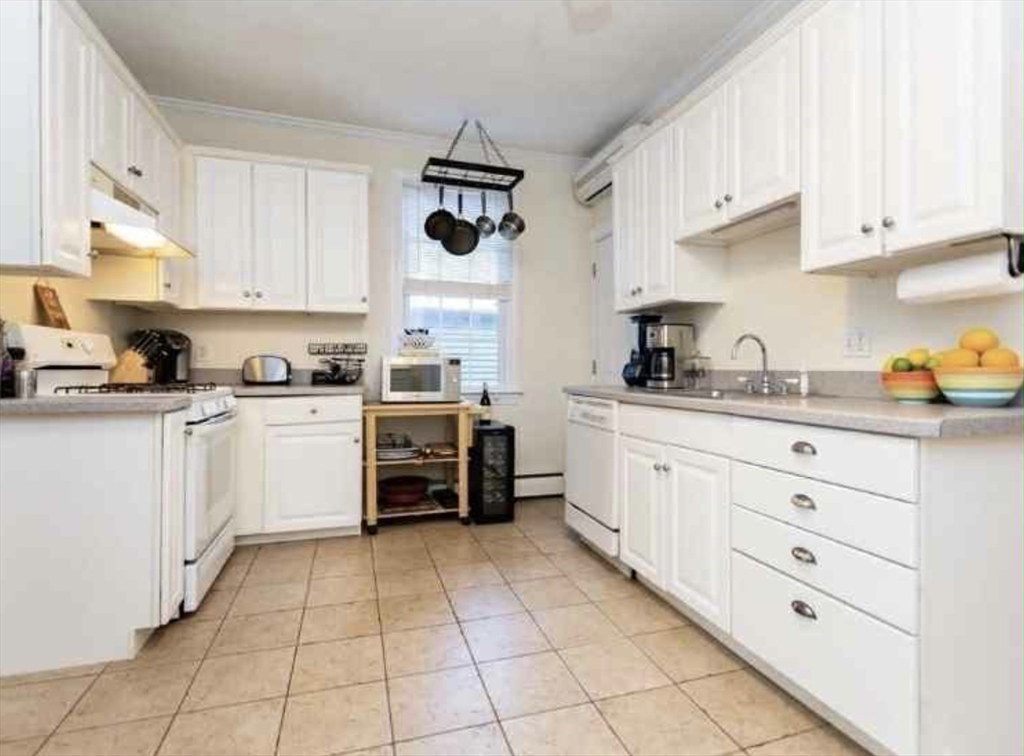 34 Austin Street, Unit 2 Boston, MA 02129 - Photo 10 of 19 a kitchen with cabinets and window