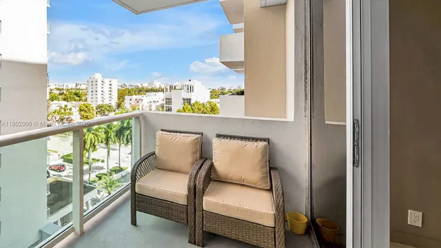a view of a balcony with furniture and garden
