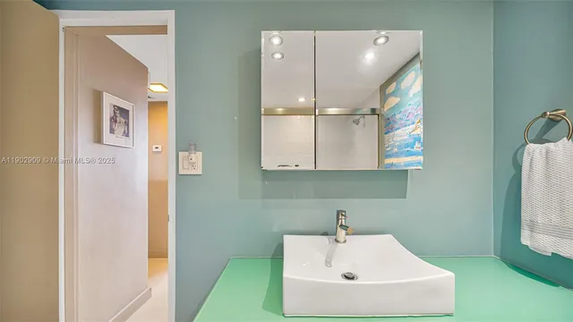 a bathroom with a sink and a mirror