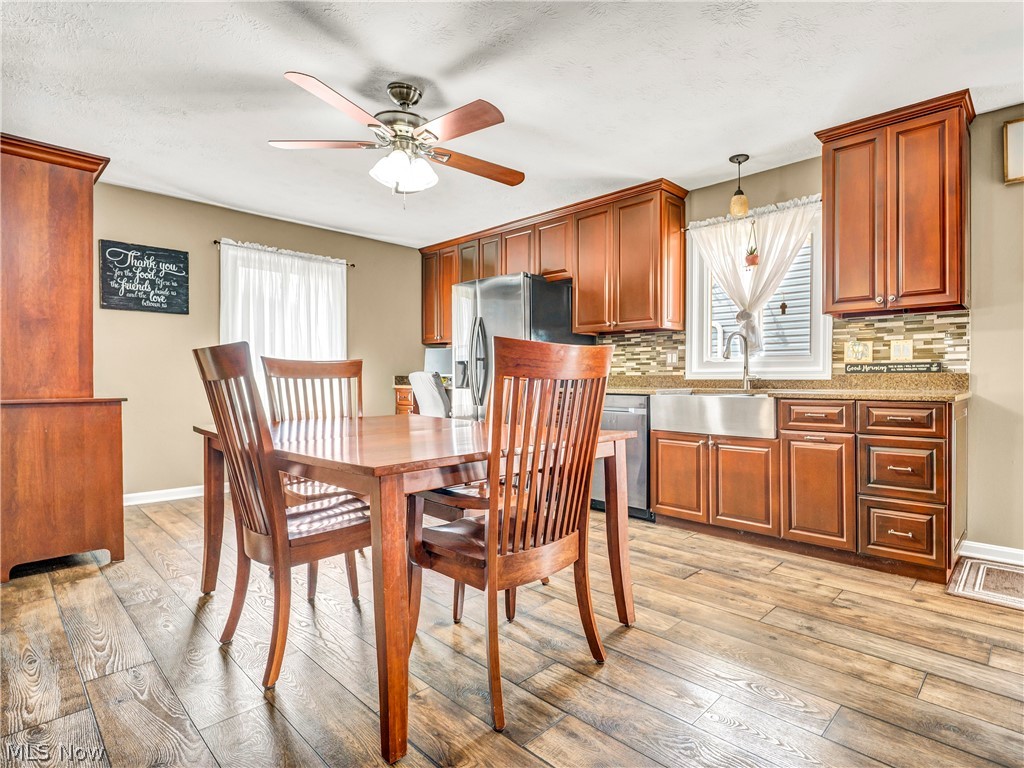 977 Lloyd Road Wickliffe, OH 44092 - Photo 10 of 38 Kitchen with wood-finish flooring and rich wood cabinetry