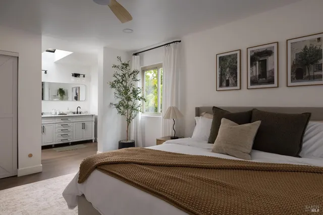 a bedroom with a bed and a couch