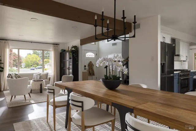 a view of a dining room with furniture window and outside view