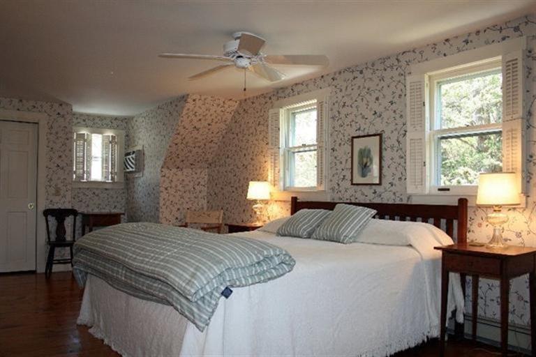 52 Cedar Land Road Orleans, MA 02653 - Photo 11 of 16 a bedroom with a bed two lamps and windows