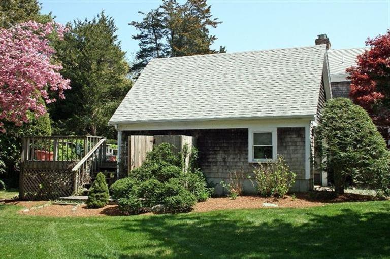 52 Cedar Land Road Orleans, MA 02653 - Photo 2 of 16 a view of a house with backyard and garden