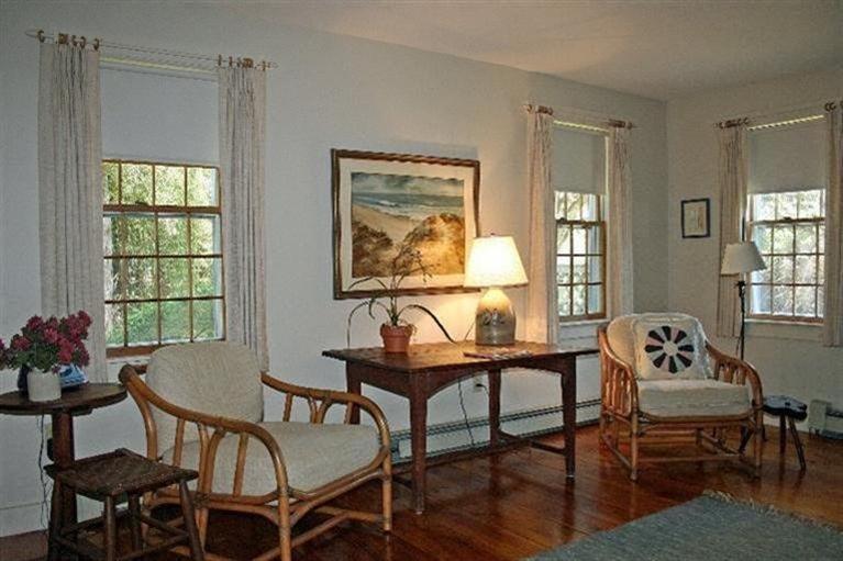 52 Cedar Land Road Orleans, MA 02653 - Photo 8 of 16 a dining room with furniture and window wooden floor