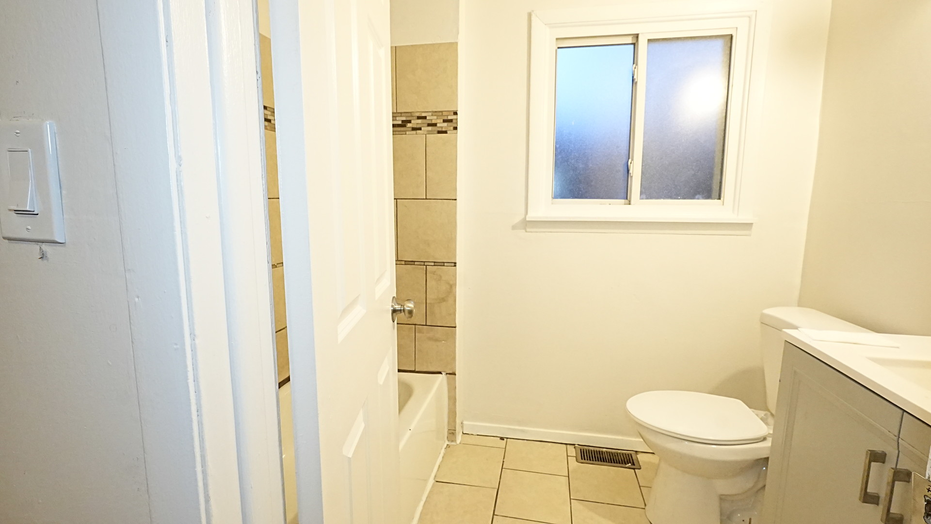 16918 Orchard Ridge Avenue Hazel Crest, IL 60429 - Photo 12 of 21 a white toilet sitting next to a bathroom sink