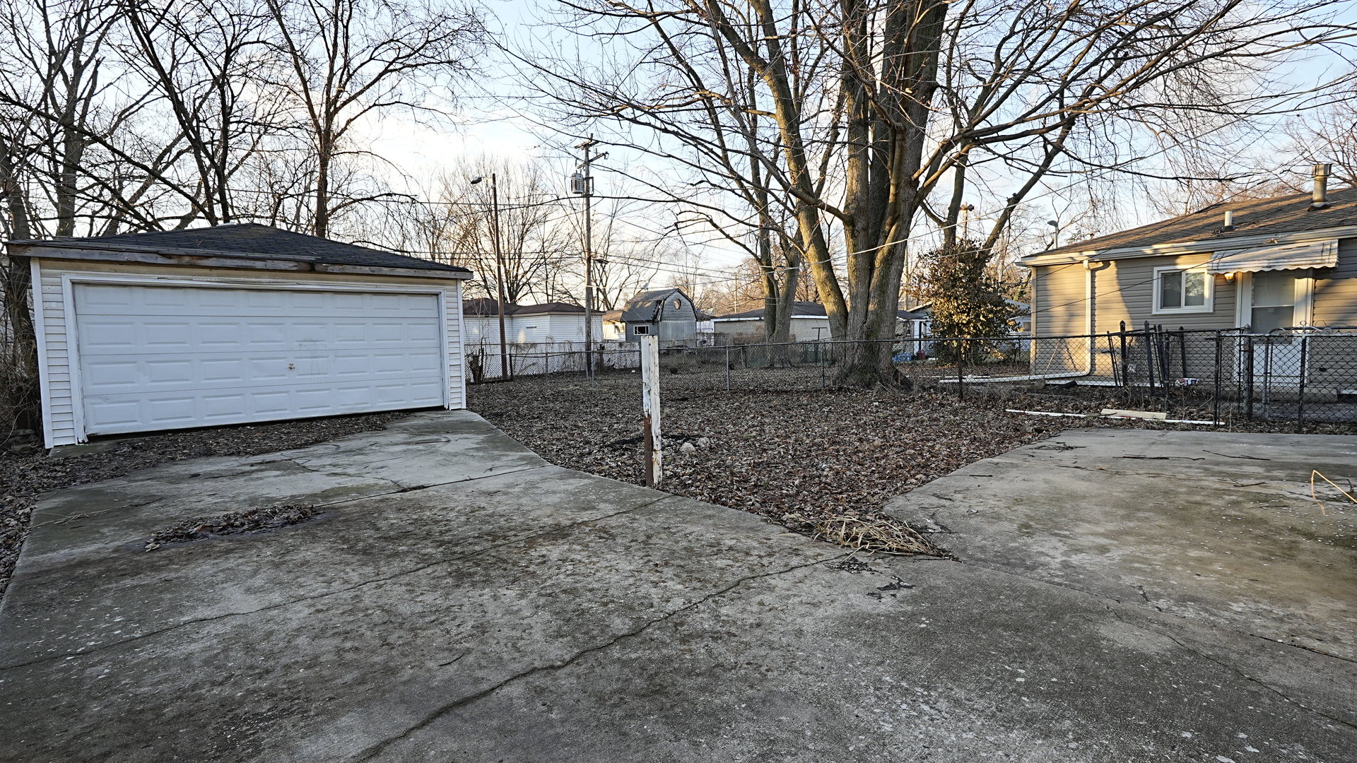 16918 Orchard Ridge Avenue Hazel Crest, IL 60429 - Photo 20 of 21 a view of a house with a snow in the yard
