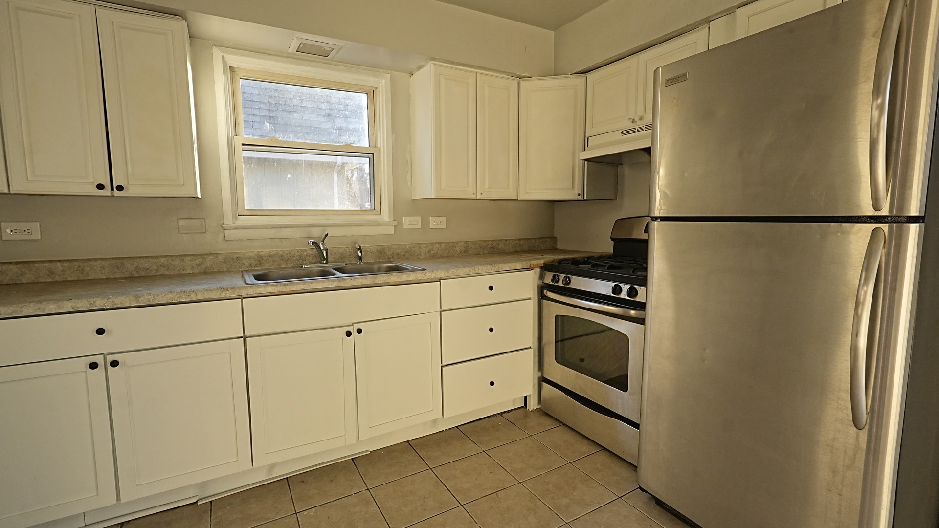 16918 Orchard Ridge Avenue Hazel Crest, IL 60429 - Photo 5 of 21 a kitchen with white cabinets white stainless steel appliances and sink