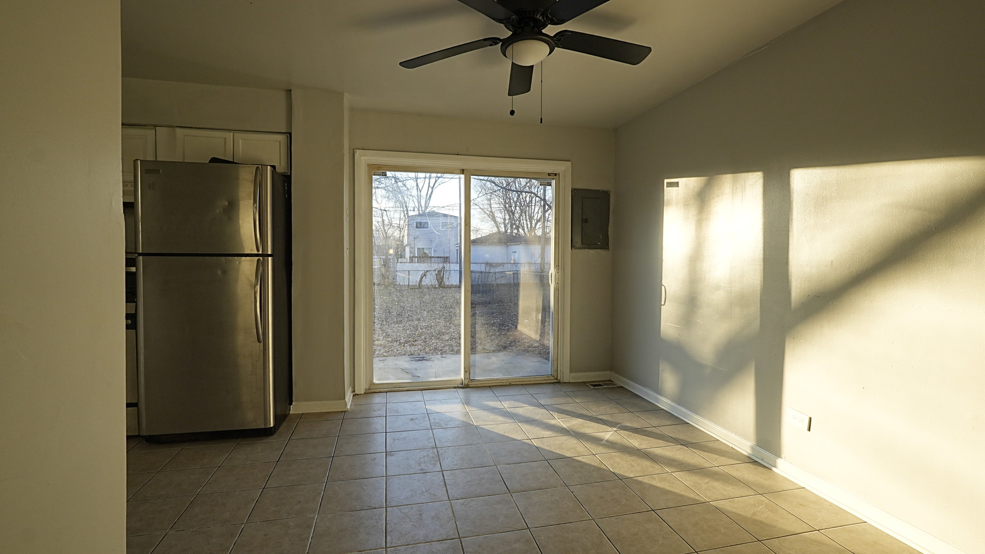 16918 Orchard Ridge Avenue Hazel Crest, IL 60429 - Photo 7 of 21 a view of a refrigerator in kitchen and an empty room