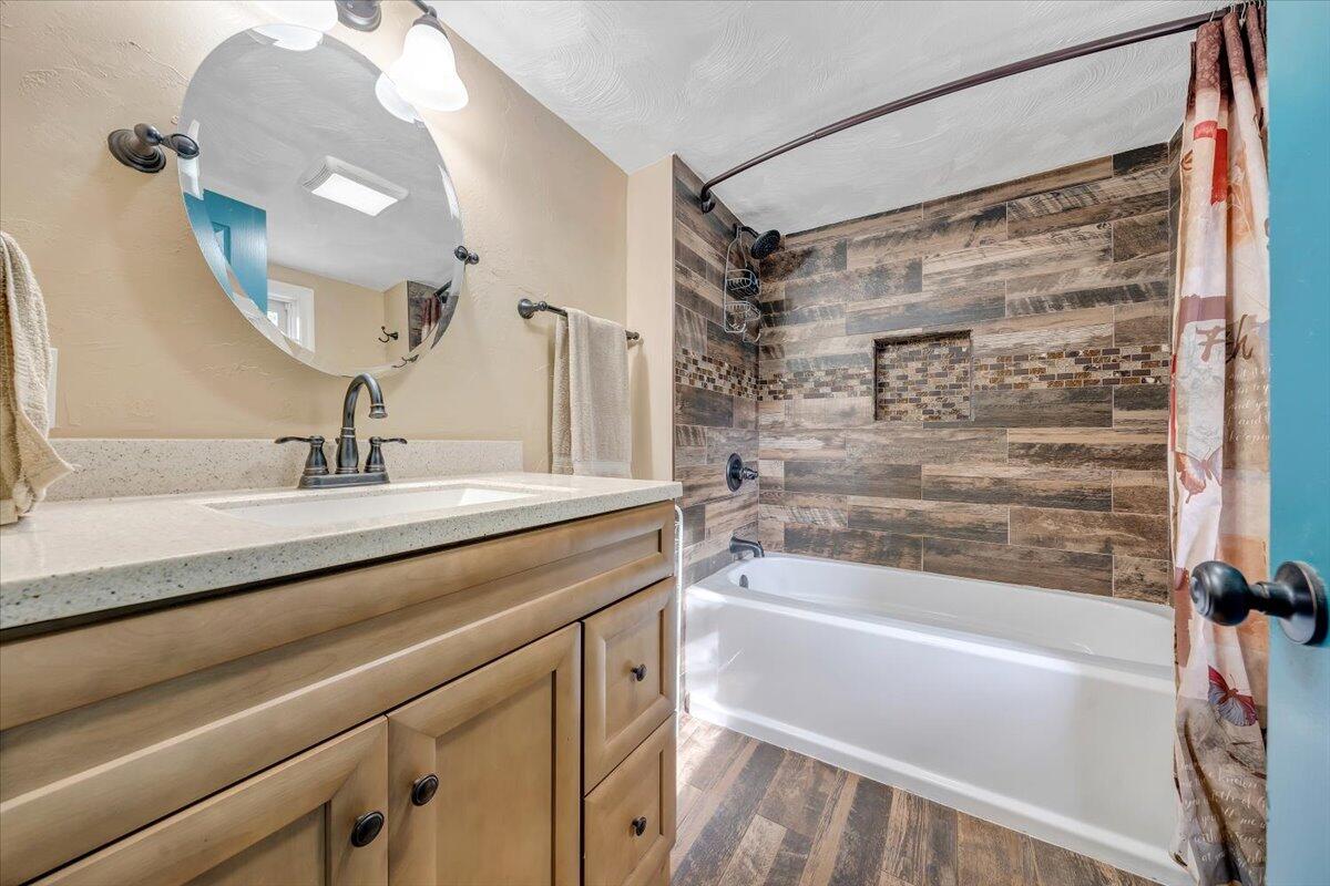 6702 Ferrum Mountain Road Callaway, VA 24067 - Photo 15 of 45 a bathroom with a bathtub and a sink