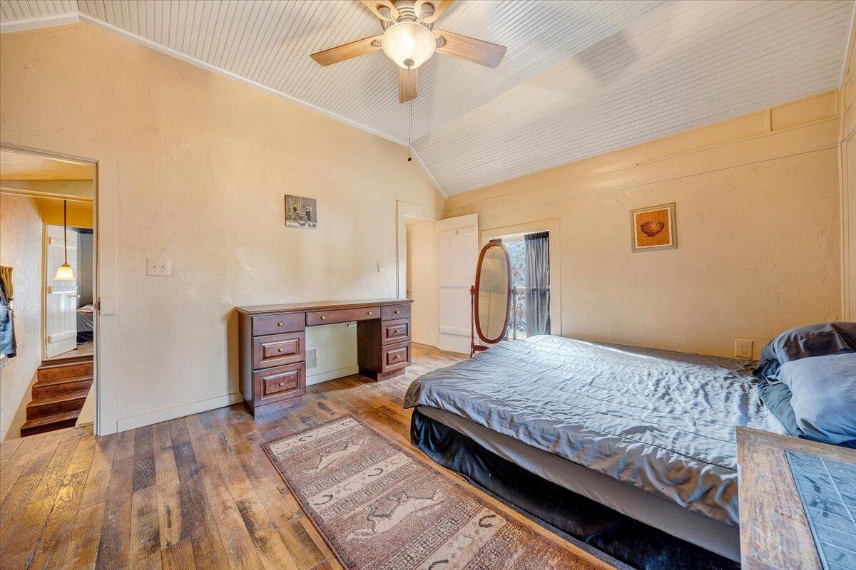 6702 Ferrum Mountain Road Callaway, VA 24067 - Photo 18 of 45 a bedroom with a bed and a chandelier