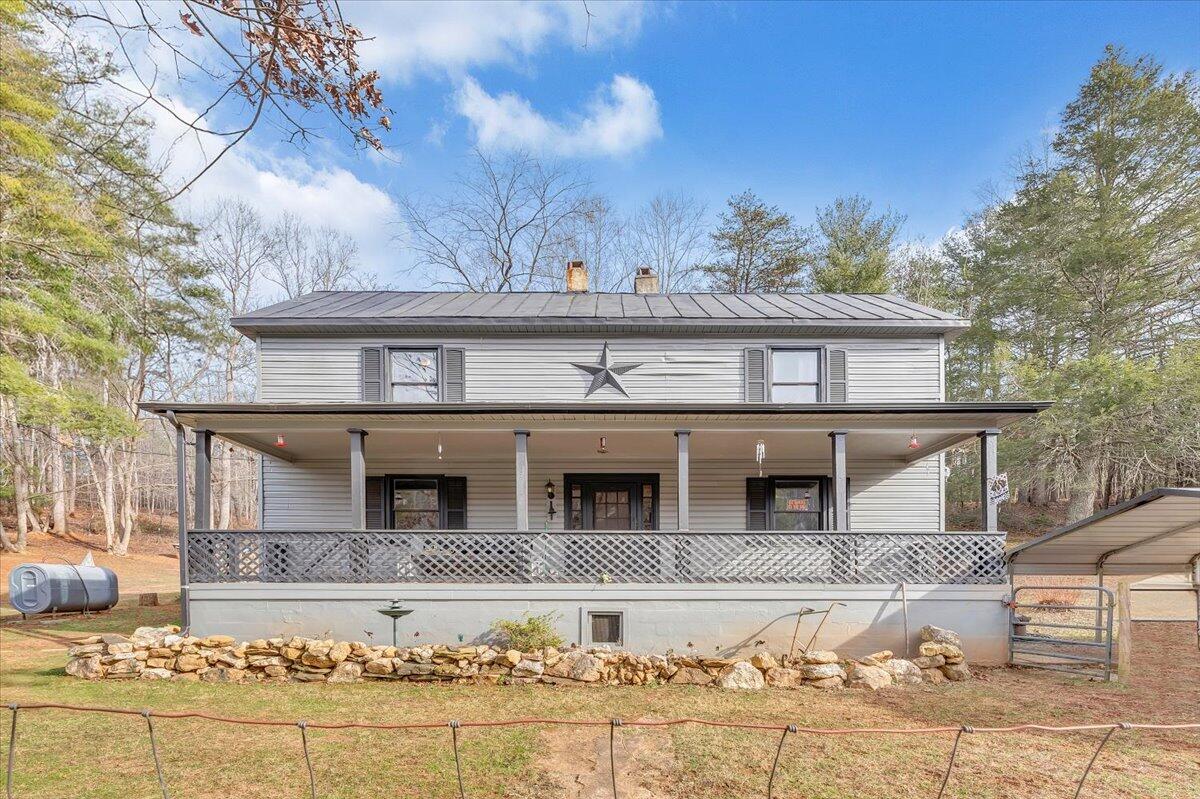 6702 Ferrum Mountain Road Callaway, VA 24067 - Photo 2 of 45 a front view of a house with a yard