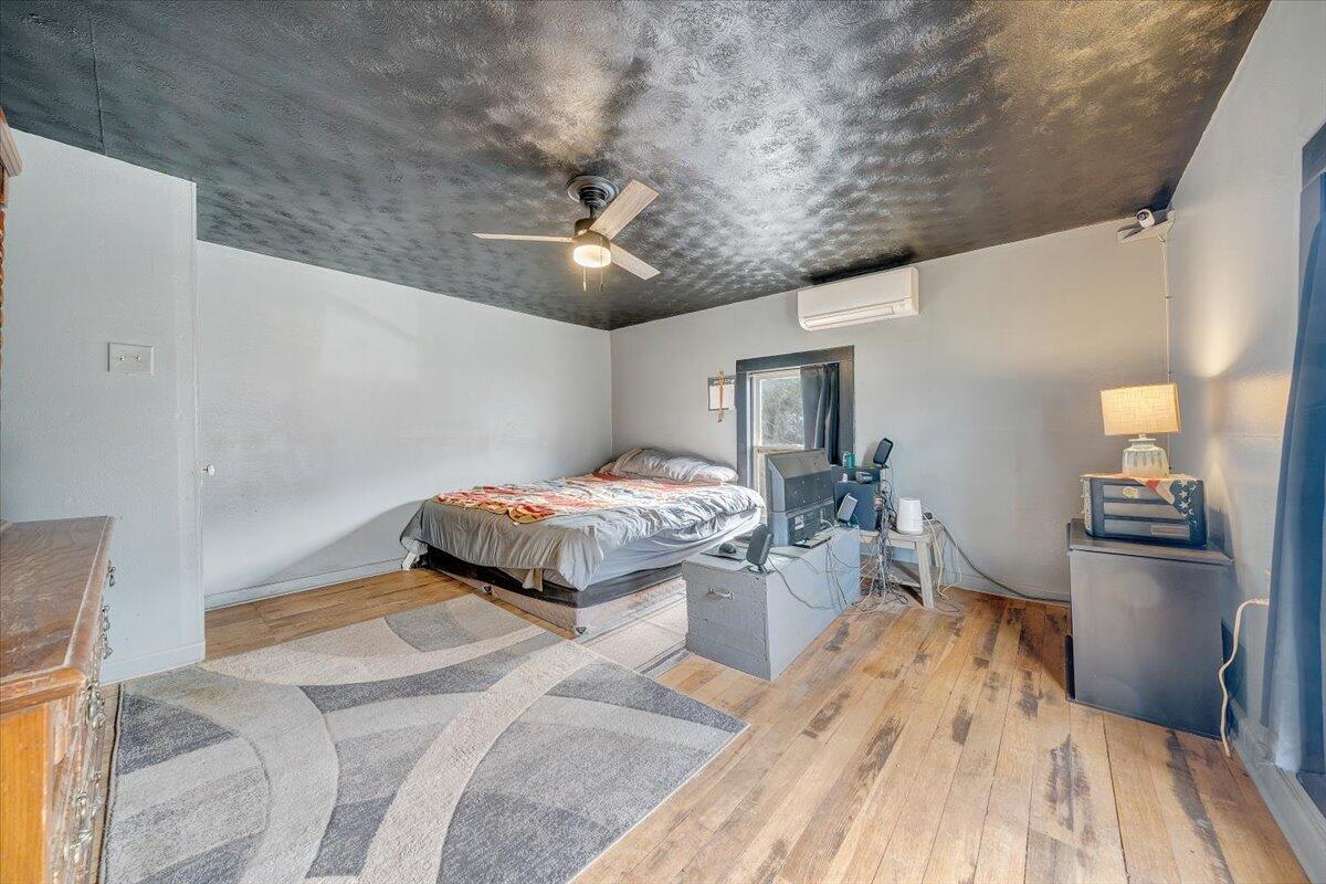 6702 Ferrum Mountain Road Callaway, VA 24067 - Photo 21 of 45 a bedroom with a bed and wooden floor