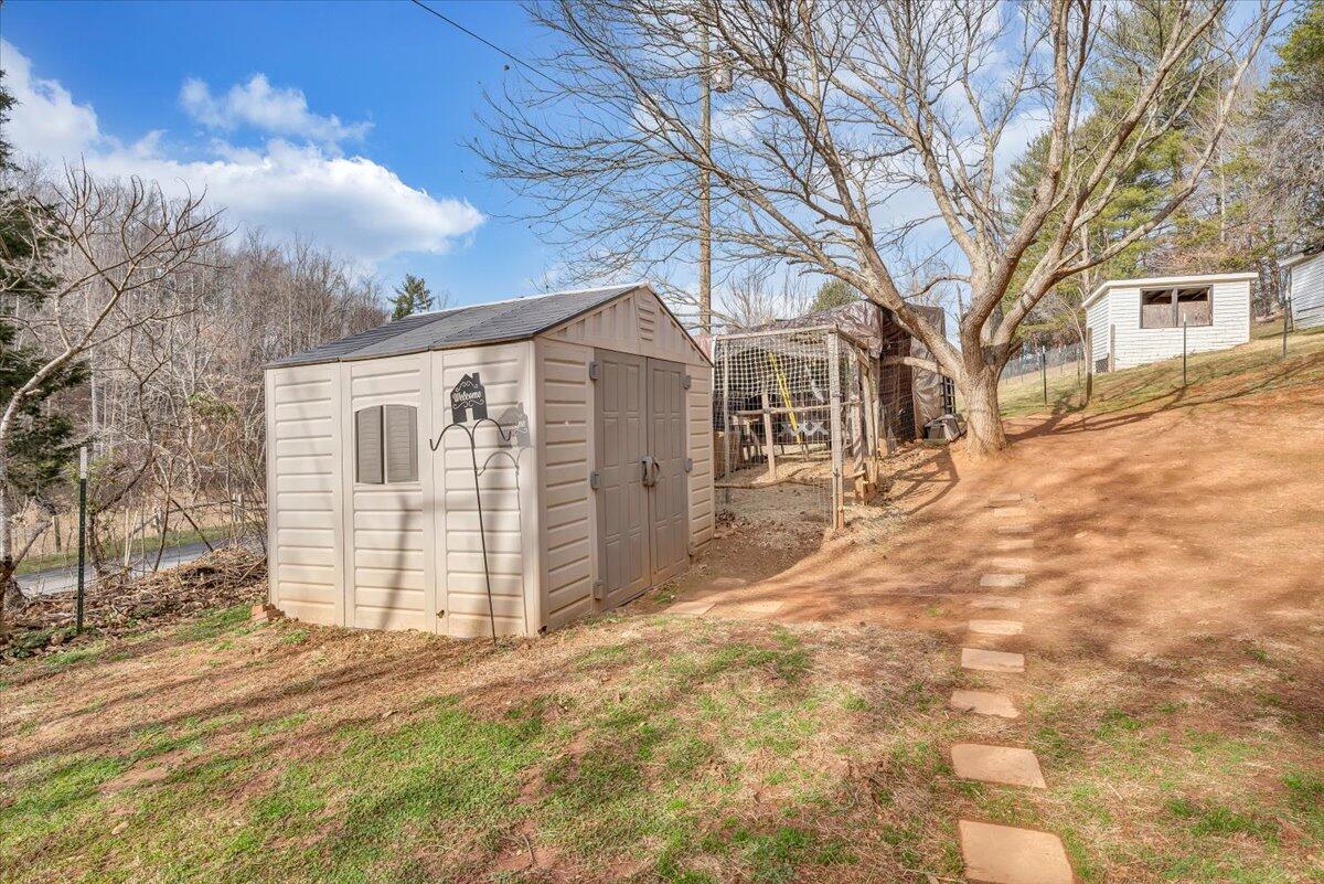 6702 Ferrum Mountain Road Callaway, VA 24067 - Photo 26 of 45 a view of a white house with a yard