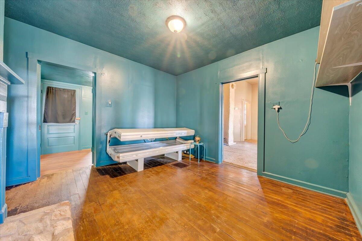 6702 Ferrum Mountain Road Callaway, VA 24067 - Photo 7 of 45 a bedroom with a bed and a chandelier