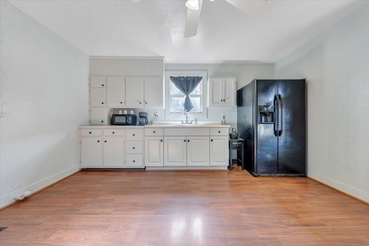 6702 Ferrum Mountain Road Callaway, VA 24067 - Photo 8 of 45 a view of a kitchen with a sink and a refrigerator