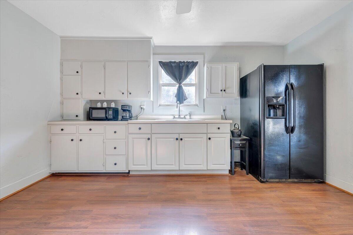 6702 Ferrum Mountain Road Callaway, VA 24067 - Photo 9 of 45 a kitchen with stainless steel appliances a refrigerator sink and cabinets