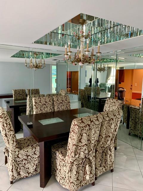 6400 Northwest 2nd Avenue, Unit 417 Boca Raton, FL 33487 - Photo 12 of 66 a living room with furniture and a floor to ceiling window