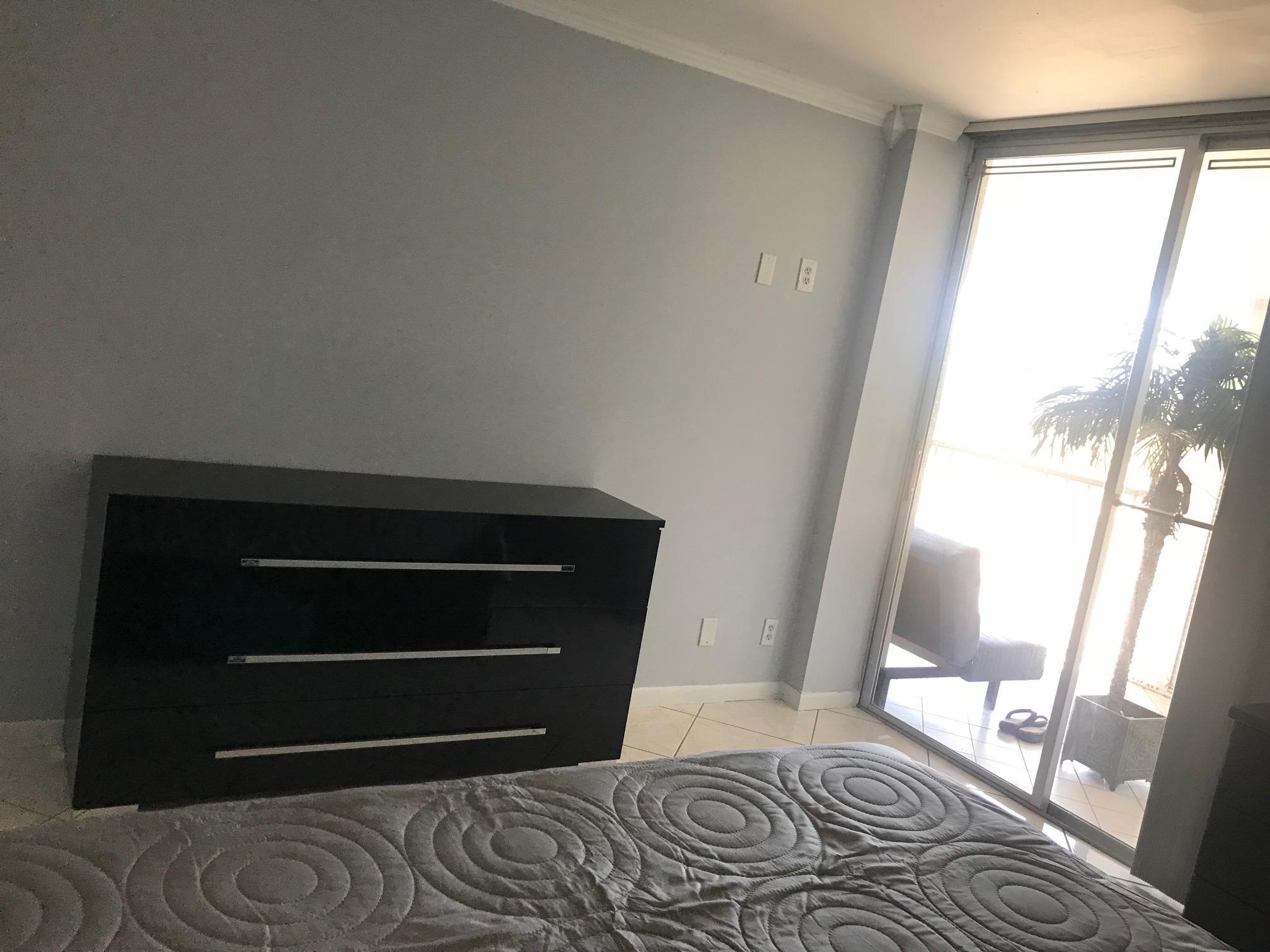 6400 Northwest 2nd Avenue, Unit 417 Boca Raton, FL 33487 - Photo 21 of 66 a bedroom with a bed and a window