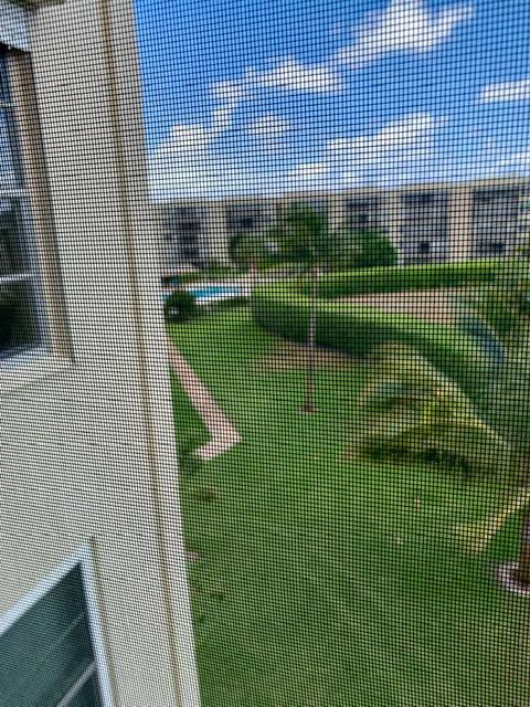 6400 Northwest 2nd Avenue, Unit 417 Boca Raton, FL 33487 - Photo 29 of 66 a view of building with a swimming pool