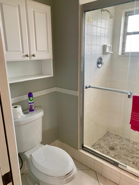 6400 Northwest 2nd Avenue, Unit 417 Boca Raton, FL 33487 - Photo 37 of 66 a white toilet sitting next to a bathroom sink