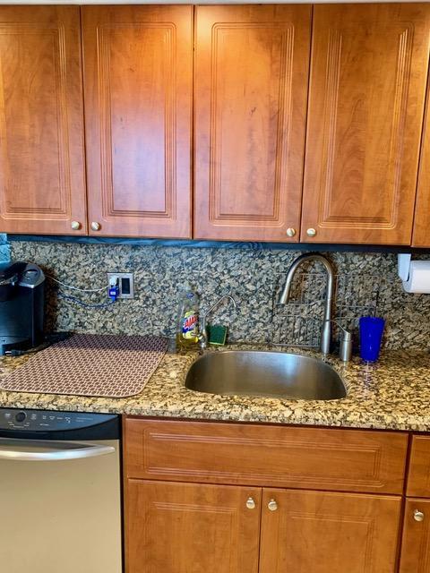 6400 Northwest 2nd Avenue, Unit 417 Boca Raton, FL 33487 - Photo 48 of 66 a kitchen with a sink a stove and a microwave