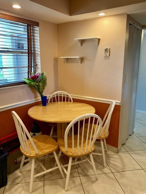 6400 Northwest 2nd Avenue, Unit 417 Boca Raton, FL 33487 - Photo 51 of 66 a view of a dining room with furniture and window