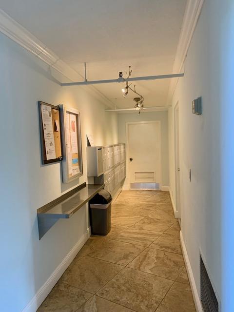 6400 Northwest 2nd Avenue, Unit 417 Boca Raton, FL 33487 - Photo 57 of 66 a view of a hallway with wooden floor and staircase