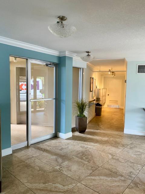 6400 Northwest 2nd Avenue, Unit 417 Boca Raton, FL 33487 - Photo 6 of 66 a view of a livingroom with wooden floor and a livingroom
