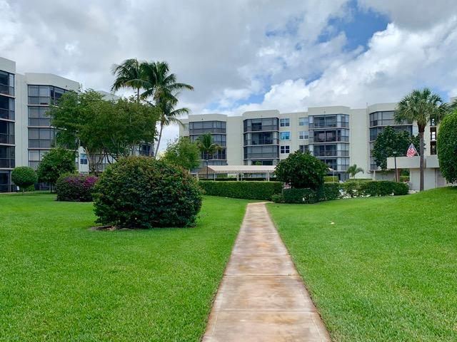 6400 Northwest 2nd Avenue, Unit 417 Boca Raton, FL 33487 - Photo 61 of 66 a front view of a house with garden
