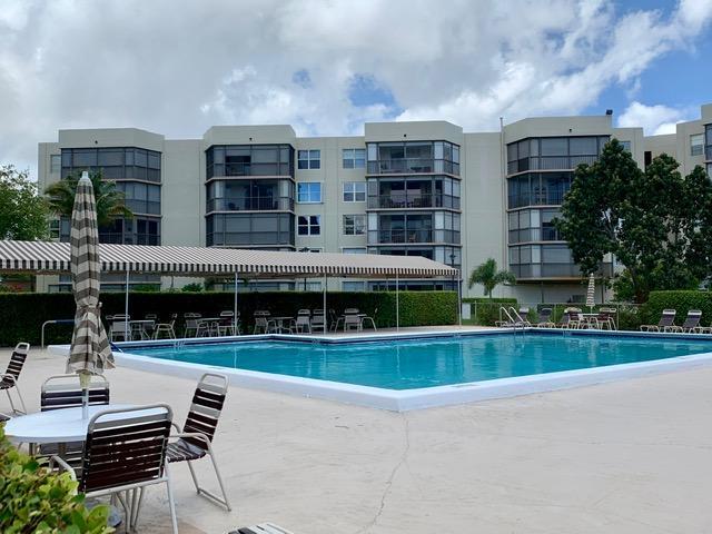 6400 Northwest 2nd Avenue, Unit 417 Boca Raton, FL 33487 - Photo 63 of 66 a swimming pool view with a outdoor seating