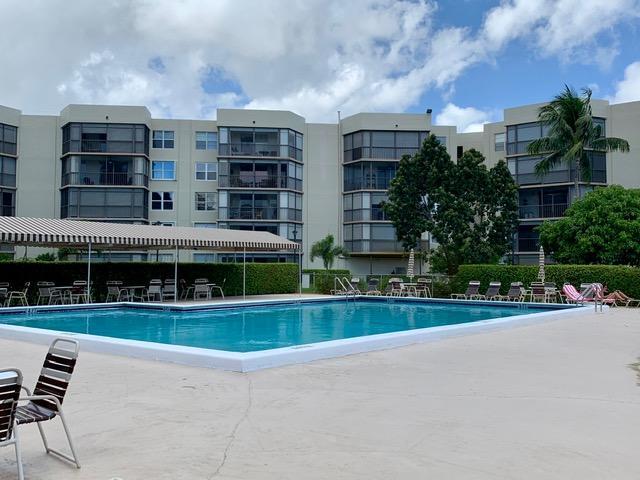 6400 Northwest 2nd Avenue, Unit 417 Boca Raton, FL 33487 - Photo 64 of 66 a front view of building with yard
