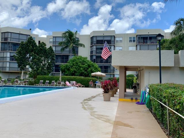 6400 Northwest 2nd Avenue, Unit 417 Boca Raton, FL 33487 - Photo 65 of 66 a front view of a house with porch and furniture