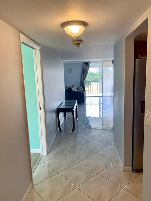 6400 Northwest 2nd Avenue, Unit 417 Boca Raton, FL 33487 - Photo 10 of 66 a view of a room with furniture and a window