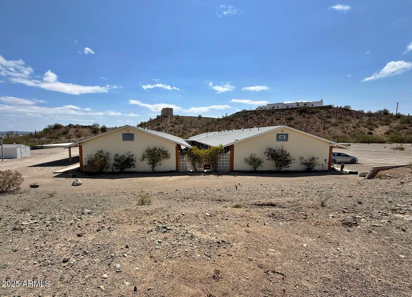 355 South Sahuaro Street Ajo, AZ 85321 - Photo 2 of 10 a view of large house with a road