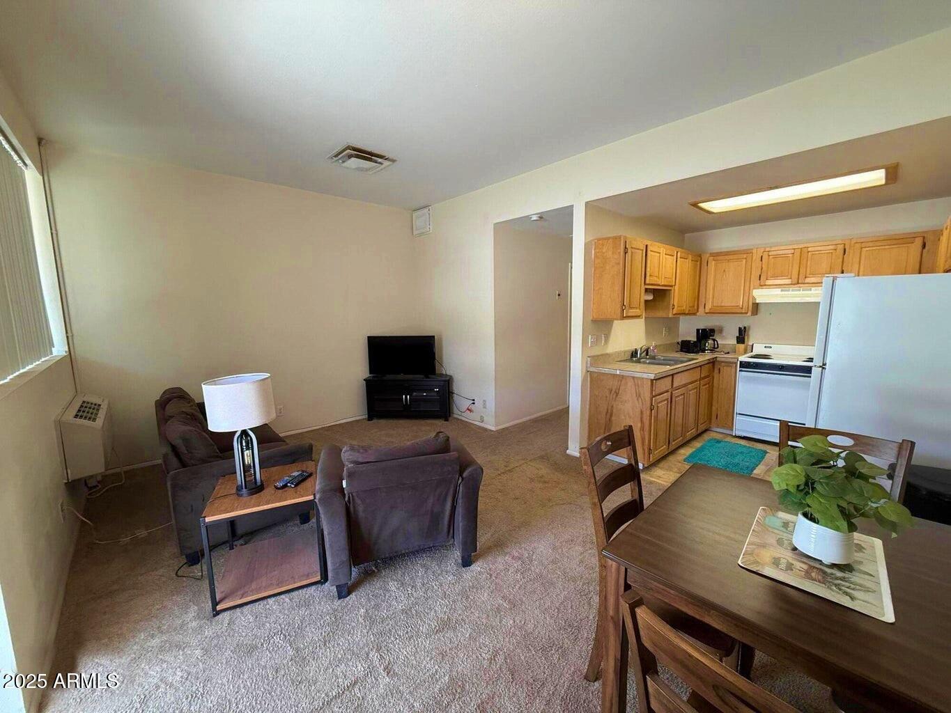 355 South Sahuaro Street Ajo, AZ 85321 - Photo 3 of 10 a living room with furniture and a flat screen tv