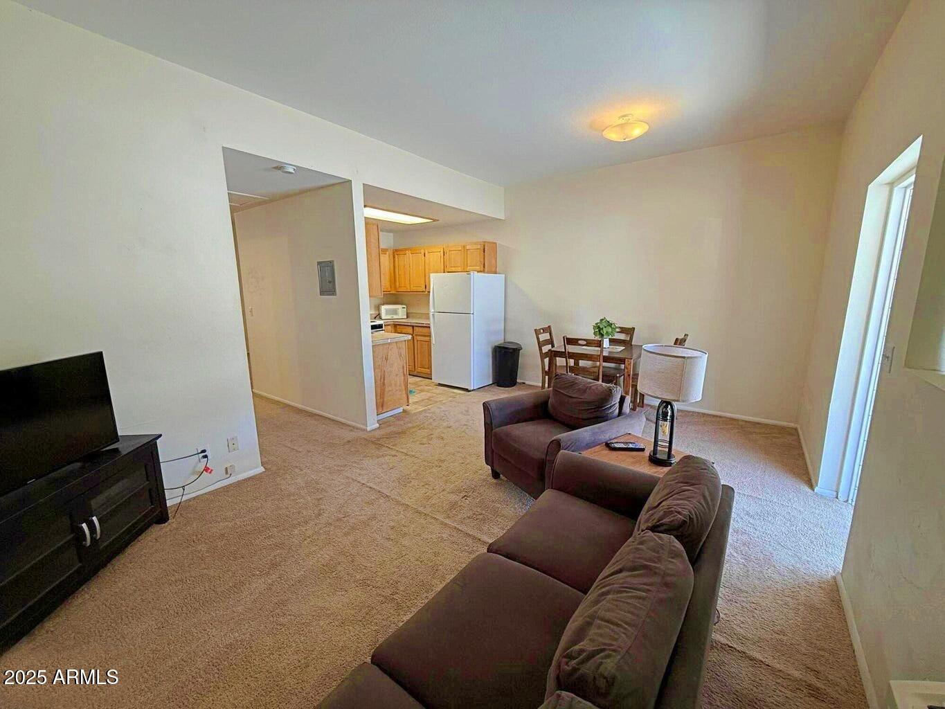 355 South Sahuaro Street Ajo, AZ 85321 - Photo 4 of 10 a living room with furniture and a flat screen tv