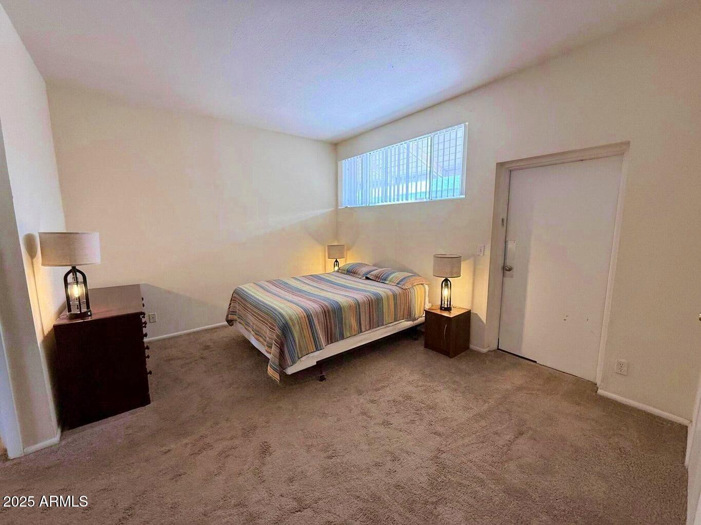 355 South Sahuaro Street Ajo, AZ 85321 - Photo 6 of 10 a bedroom with a bed and a window