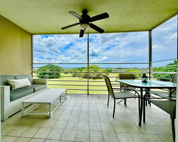 a swimming pool with outdoor seating and stairs